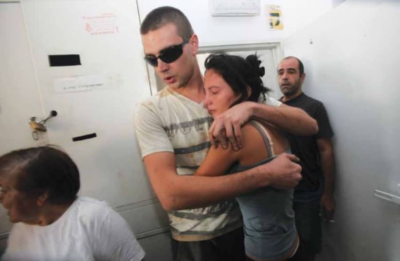  STANDING IN the safe zone as a siren sounds in Ashkelon (photo credit: YOSSI ZAMIR/FLASH90)