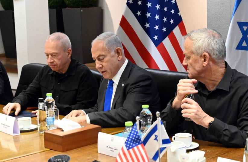Defense Minister Yoav Gallant, Prime Minister Benjamin Netanyahu, and National Unity Head Benny Gantz, Octover 12, 2023. (photo credit: CHAIM TZACH/GPO)