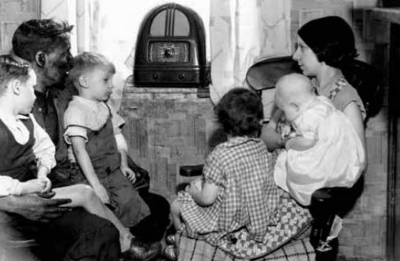  UNLIKE MANY households today, we still have a radio. Pictured: A 1937 family crowds around for updates. (photo credit: Richards/Fox Photos/Getty Images)