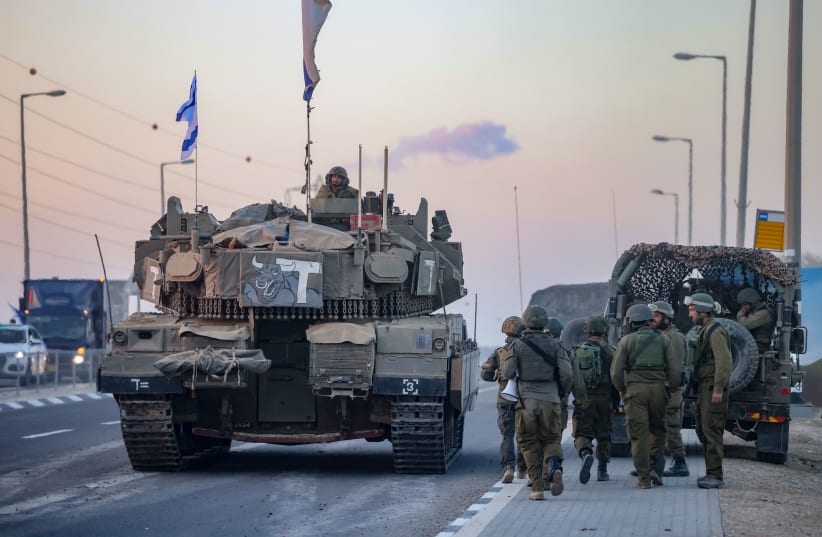  A convoy of Israeli tanks at sunset near the southern Israeli border with Gaza, October 12, 2023. (photo credit: Chaim Goldberg/Flash90)