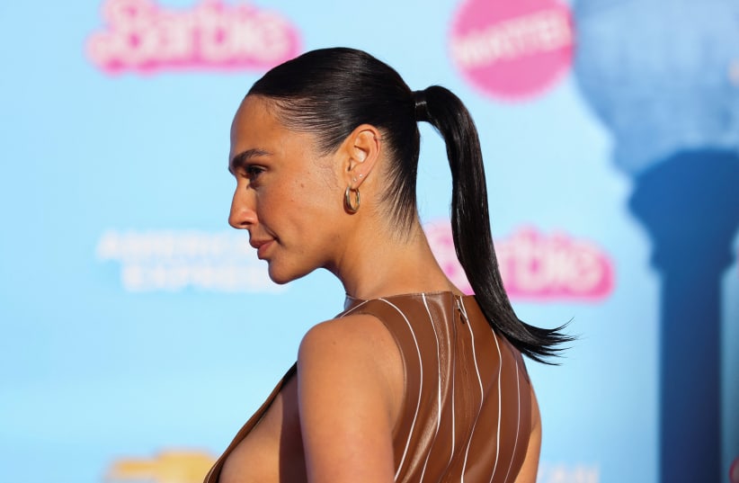  Gal Gadot poses on the pink carpet for the world premiere of the film "Barbie" in Los Angeles, California, U.S., July 9, 2023.  (photo credit: REUTERS/MIKE BLAKE)