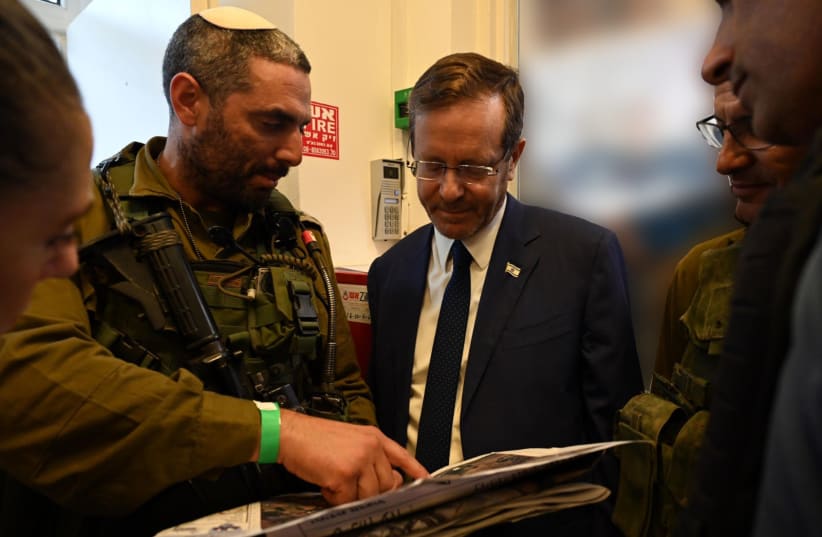  PRESIDENT ISAAC HERZOG receives a military briefing in Sderot. (photo credit: HAIM ZACH/GPO)