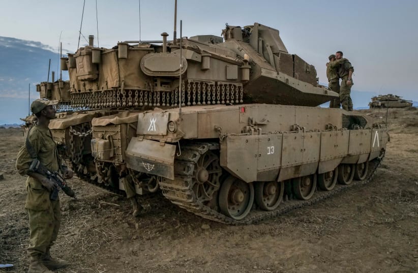 IDF Armored forces at a staging area near the northern Israeli border with Lebanon. October 14, 2023. (photo credit: MICHAEL GILADI/FLASH90)
