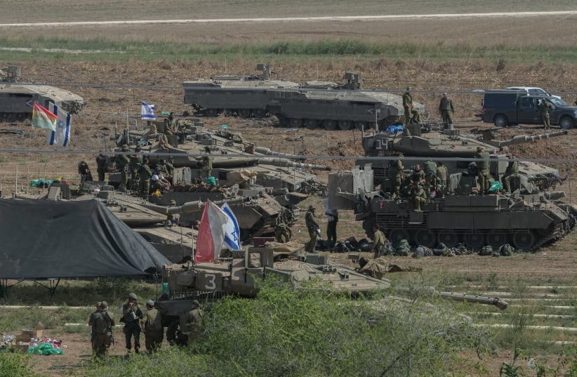  Israeli soldiers seen at a staging area near the southern Israeli border with Gaza, October 14, 2023.  (photo credit: ERIK MARMOR/FLASH90)
