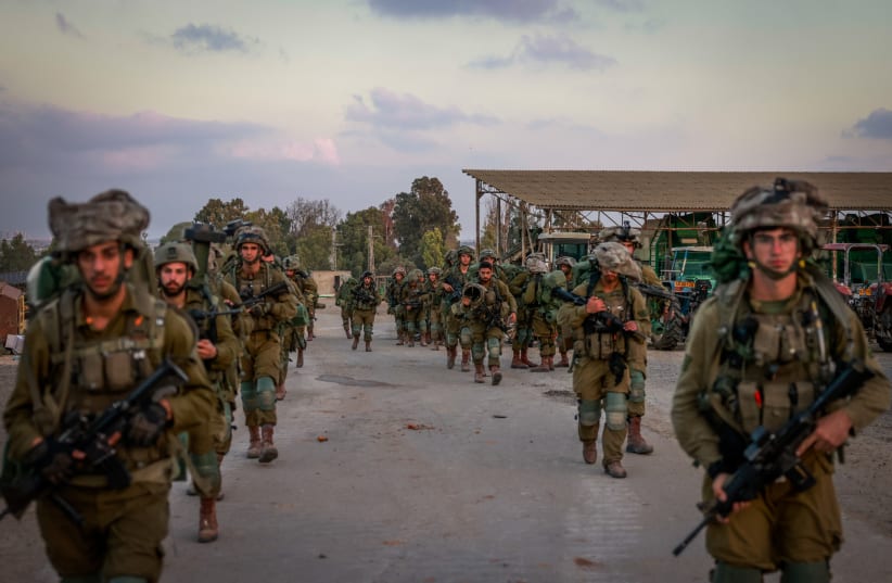  Israeli soldiers seen in Kibbutz Be'eri, near the Israeli-Gaza border, in southern Israel, October 11, 2023. (photo credit: Chaim Goldberg/Flash90)