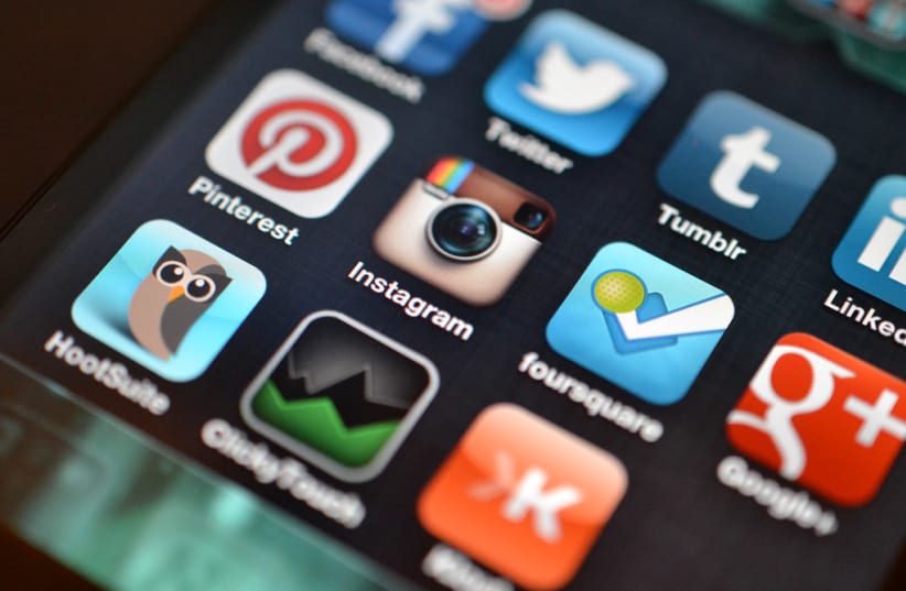  Social media apps on a mobile phone. (photo credit: FLICKR)
