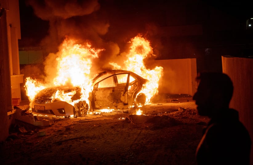 Israeli security forces at the scene where a rocket fired from the Gaza Strip hit a home and a car in the southern Israeli city of Sderot, October 17, 2023.  (photo credit: YONATAN SINDEL/FLASH90)