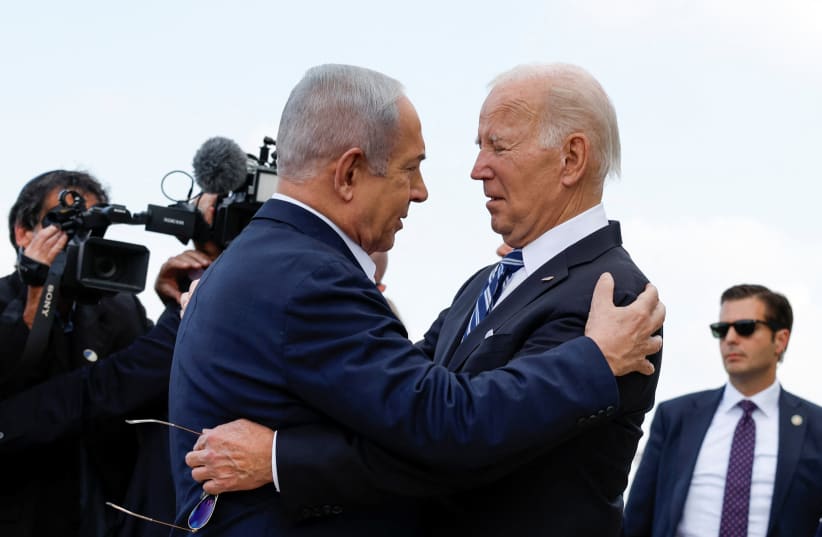  US President Joe Biden is welcomed by Israeli Prime Minster Benjamin Netanyahu, as he visits Israel amid the ongoing conflict between Israel and Hamas, in Tel Aviv, Israel, October 18, 2023 (photo credit: REUTERS/EVELYN HOCKSTEIN)