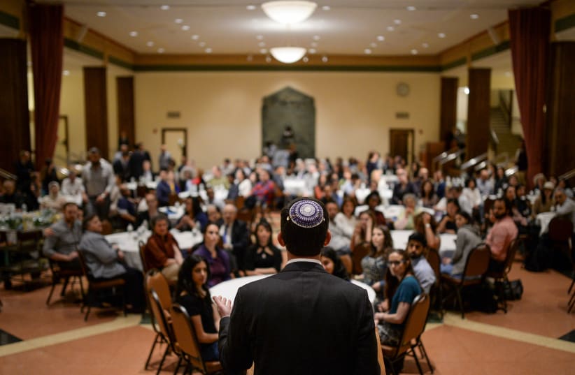  Rabbi Joshua M. Davidson addresses interfaith attendees at an Iftar feast during Ramadan hosted at the Temple Emanu-El in Manhattan, New York, U.S., June 15, 2017. (photo credit: REUTERS/AMR ALFIKY)
