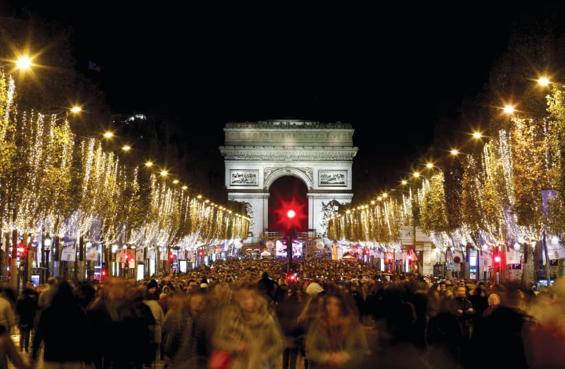  Lights along the Champs-Elysees with the Arc de Triomphe in the background. (photo credit: BENOIT TESSIER/REUTERS)