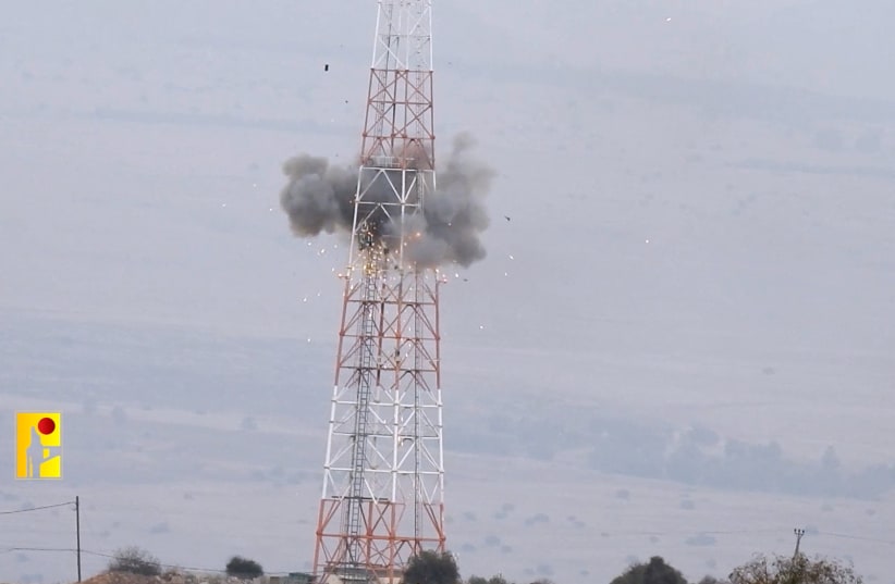  An explosion is seen on a tower that the Islamic Resistance said was at an Israeli military site near the Israel-Lebanon border on October 19, 2023 (photo credit: VIA REUTERS)