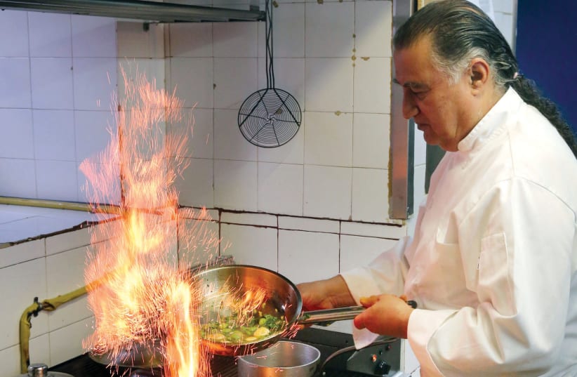  Chef Moshe Basson in the kitchen of his restaurant, Eucalyptus (photo credit: MARC ISRAEL SELLEM)