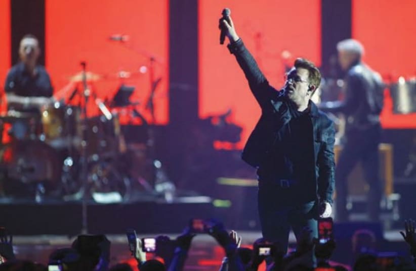  BONO OF U2 – Just days after the massacre, he dedicated ‘Pride (In the Name of Love)’ to the victims of the SuperNova festival and honored them by changing the lyrics.  (photo credit: STEVE MARCUS/REUTERS)