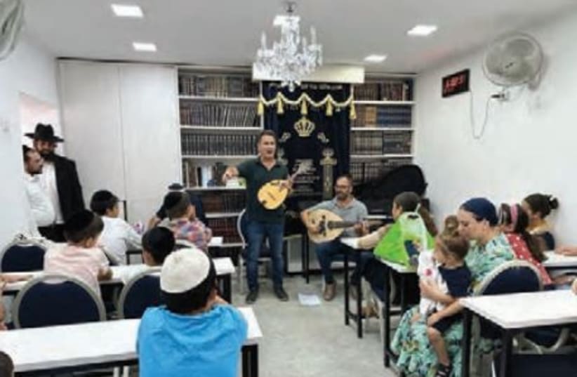  A PERFORMANCE in a safe room-turned synagogue in Netivot. (photo credit: SHMUEL ELBAZ)