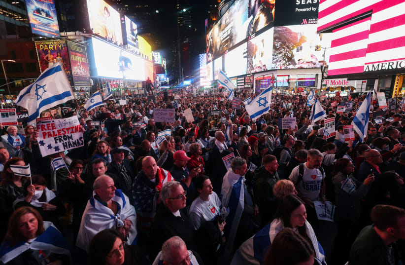 People gather for a demonstration at Times Square to express solidarity with Israel, amid the ongoing conflict between Israel and the Palestinian Islamist group Hamas, in New York City, U.S., October 19, 2023. (photo credit: Mike Segar/Reuters)