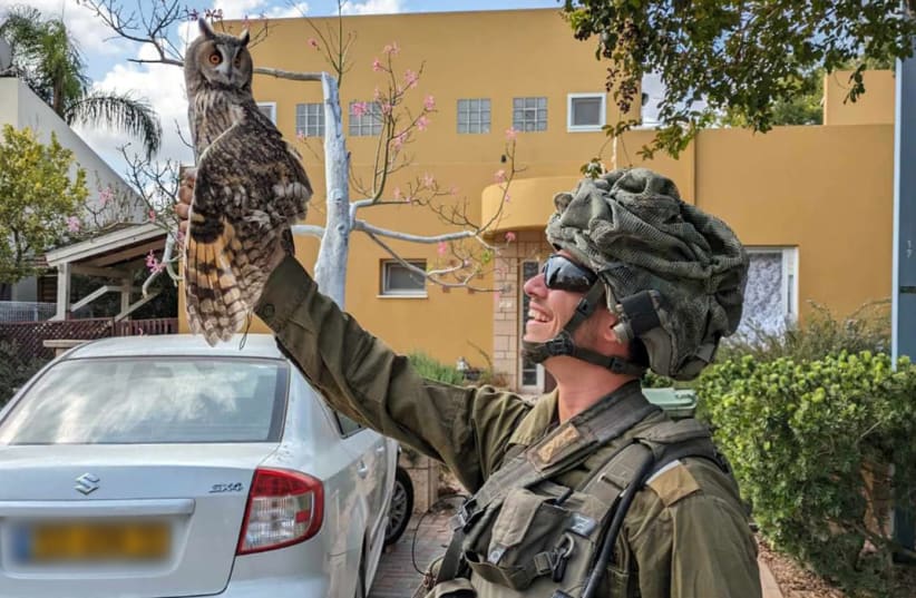  Nahal Soldier rescues owl in Kfar Azza, October 2023 (photo credit: ISRAEL NATURE AND PARKS AUTHORITY)