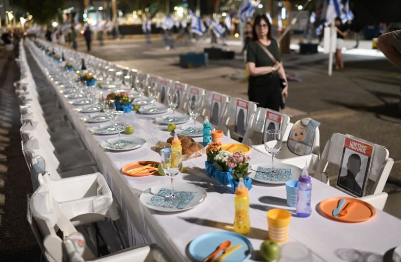  Families of Israelis held hostage by Hamas militants in Gaza set a Shabbat table with more than 200 empty seats for the hostages, at the "Hostages Square", outside the Art Museum of Tel Aviv, October 20, 2023. (photo credit: GILI YAARI /FLASH90)