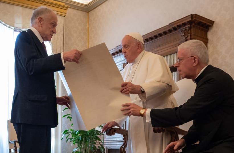  World Jewish Congress President Ronald Lauder gives Pope Francis a a “Kishreinu” (Hebrew for “Our Bond”) document marking influence of the Catholic Church's Nostra Aetate declaration on Catholic-Jewish relations, Oct. 19, 2023.  (photo credit: SHAHAR AZRAN / WJC)