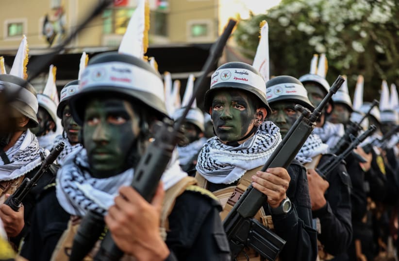 ISLAMIC JIHAD supporters participate in an anti-Israel rally marking the 36th anniversary of the movement’s foundation, in Gaza City on October 6, the day before the outbreak of this war. (photo credit: ATIA MOHAMMED/FLASH90)