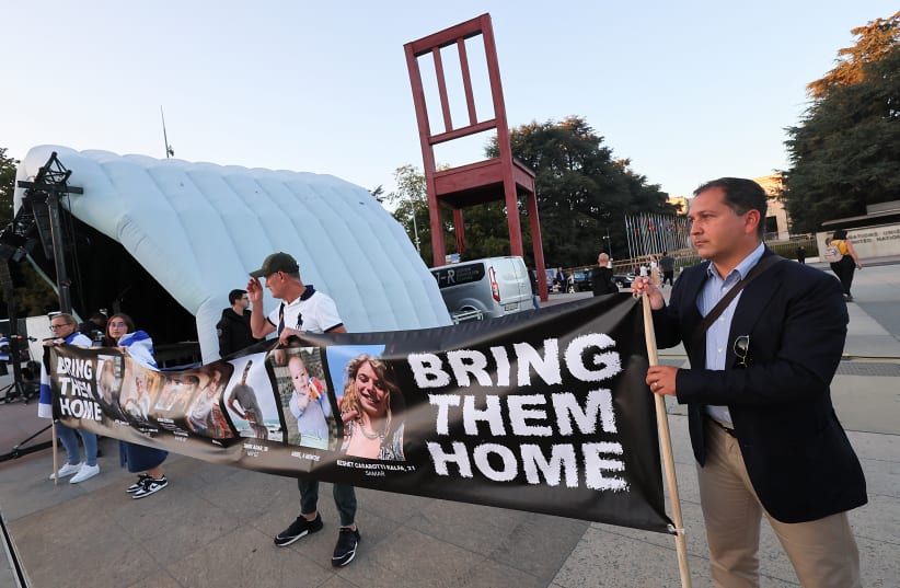  People attend a demonstration organised by the Switzerland-Israel Association against the attacks by Hamas, outside the United Nations in Geneva, Switzerland, October 11, 2023. (Not the demonstration mentioned in this article.) (photo credit: REUTERS/DENIS BALIBOUSE)