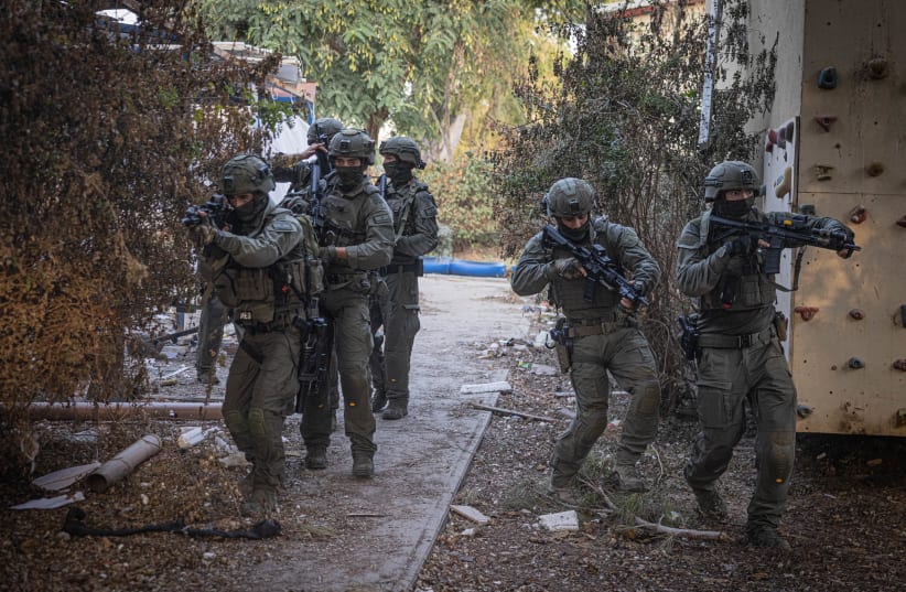  Members of the tactical unit of the Yamas patrol in Kibbutz Be'eri, near the Israeli-Gaza border, southern Israel. October 22, 2023 (photo credit: Chaim Goldberg/Flash90)