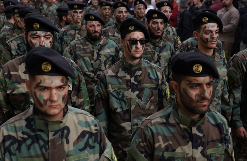  People take part in the funeral of Hezbollah member Abbas Shuman, who was killed in southern Lebanon amid tension between Israel and Hezbollah, during his funeral, in Baalbek, Lebanon, October 23, 2023 (photo credit: REUTERS/AMR ALFIKY)