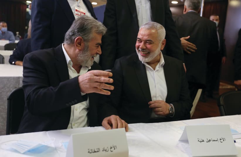  HAMAS LEADER Ismail Haniyeh (right) and Palestinian Islamic Jihad chief Ziyad al-Nakhalah attend a meeting of Palestinian factions, in Beirut, in 2020. (photo credit: AZIZ TAHER/REUTERS)