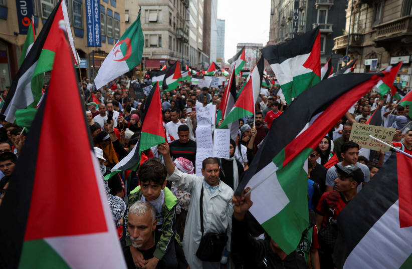  People demonstrate to express support for the Palestinians during a protest in Milan, Italy October 14, 2023. (photo credit: REUTERS/CLAUDIA GRECO)