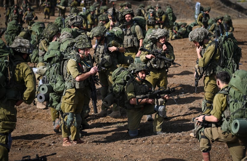  IDF reserve Infantry and Merkava Tank soldiers train in a military exercise in the Golan Heights on October 23, 2023.  (photo credit: MICHAEL GILADI/FLASH90)