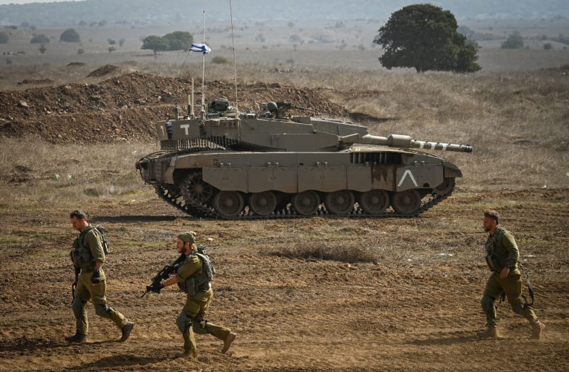  IDF reserve Infantry and Merkava Tank soldiers train in a military exercise in the Golan Heights on October 23, 2023.  (photo credit: MICHAEL GILADI/FLASH90)