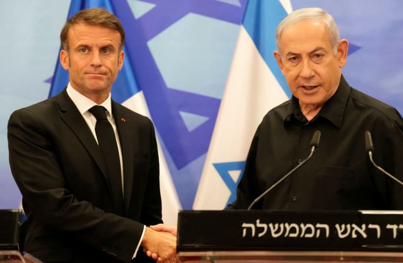  Israeli Prime Minister Benjamin Netanyahu and French President Emmanuel Macron shake hands at a joint press conference, amid the Israeli-Hamas conflict, in Jerusalem, October 24, 2023 (photo credit: CHRISTOPHE ENA/POOL VIA REUTERS)