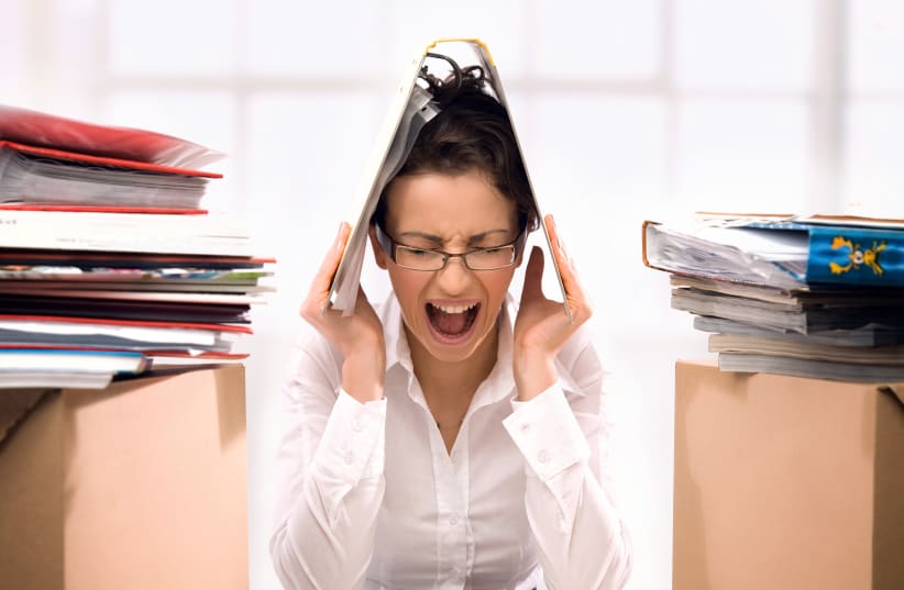  An illustrative image of an employee being stressed at work. (photo credit: INGIMAGE)