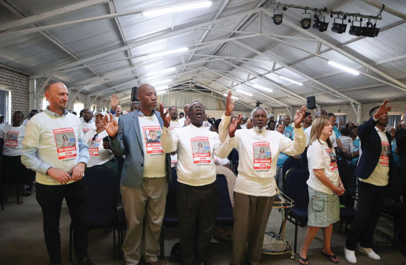  FIVE HUNDRED church leaders are in attendance at an event in Katlehong, last Friday, praying and wearing t-shirts with images of hostages held in Gaza. (photo credit: ILAN OSSENDRYVER)