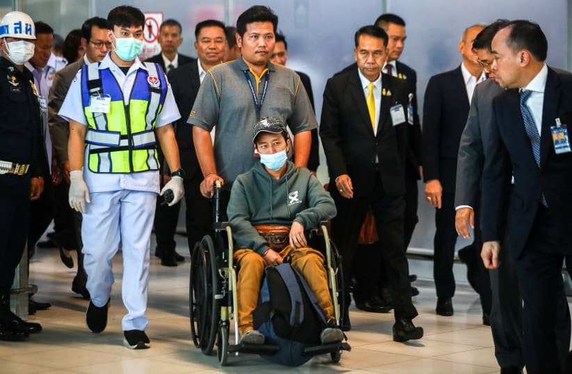  Somma, a migrant agricultural worker who was injured by a surprise attack on Israel by the Palestinian militant group Hamas, arrives at Bangkok's Suvarnabhumi Airport, Thailand, October 12, 2023.  (photo credit: REUTERS/Chalinee Thirasupa)