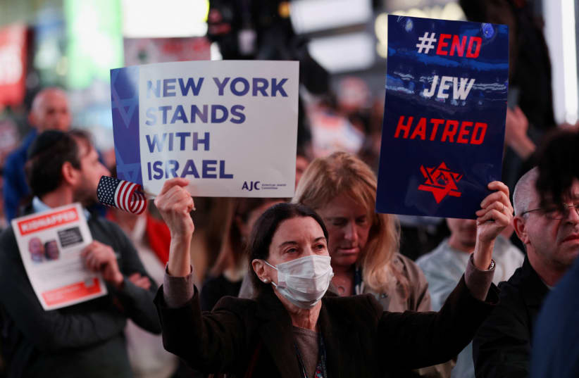  People attend a demonstration to express solidarity with Israel, amid the ongoing conflict between Israel and the Palestinian Islamist group Hamas, in New York City, U.S., October 19, 2023.  (photo credit: REUTERS/MIKE SEGAR)