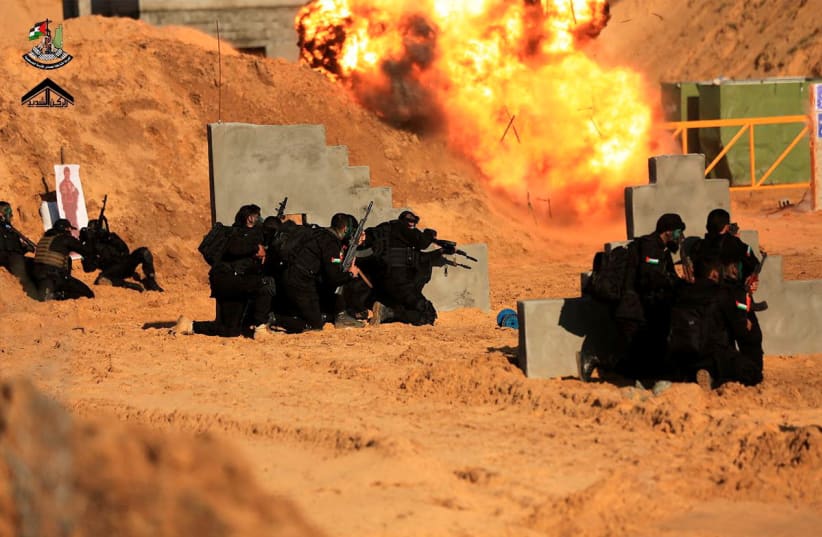  Joint Room for Palestinian Resistance Factions, a group which includes the Palestinian Islamist group Hamas, training for a "raid behind enemy lines" at an unknown location (photo credit: JOINT ROOM FOR PALESTINIAN RESISTANCE FACTIONS VIA TELEGRAM/VIA REUTERS)