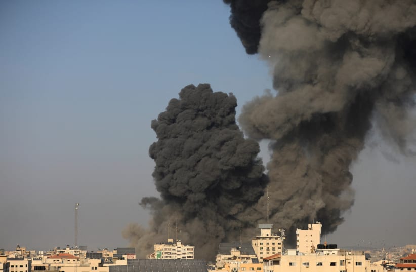  Smoke billows following an Israeli strike, in Gaza City, October 25, 2023 (photo credit: REUTERS/YASSER QUDIH)