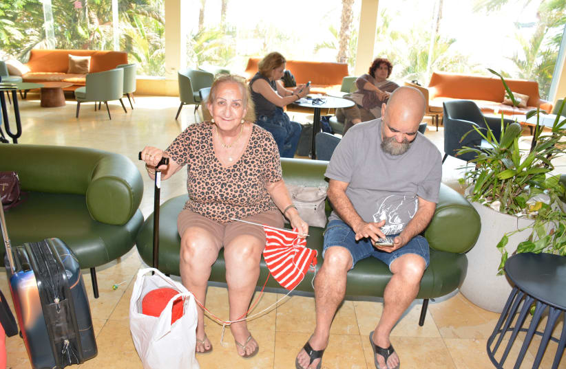  Individuals displaced from war wait in the Yirmiyahu 33 lobby (photo credit: COURTESY YAD SARAH)