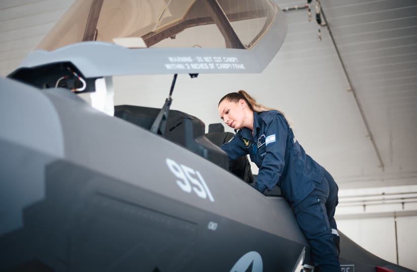  Lauren Friedman works on one of the IAF's F-35 fighter jets. (photo credit: IDF SPOKESPERSON'S UNIT)