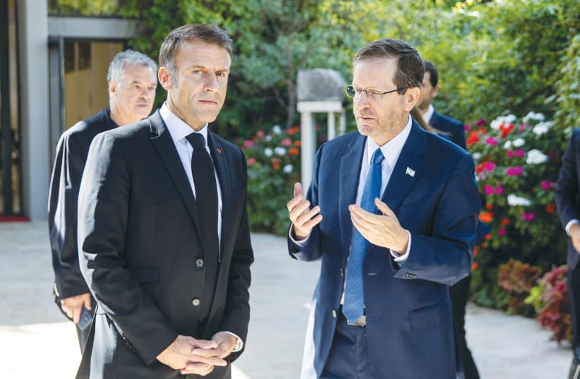  PRESIDENT ISAAC HERZOG makes a point to French President Emmanuel Macron at the President’s Residence in Jerusalem, October 2023 (photo credit: OREN BEN HAKOON/FLASH90)