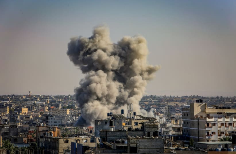  Smoke rising after an Israeli airstrike as it seen from Rafah, in the southern Gaza Strip, on October 25, 2023 (photo credit: ABED RAHIM KHATIB/FLASH90)