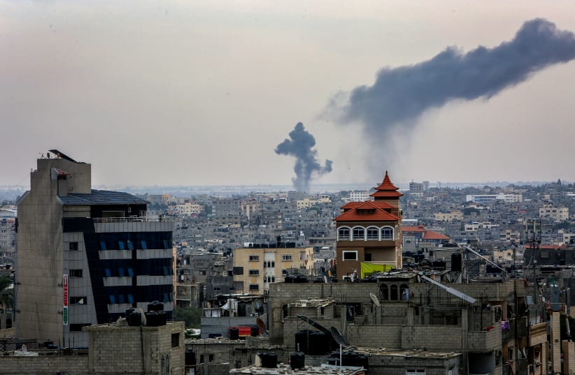  Smoke rising after an Israeli airstrike as it seen from Rafah, in the southern Gaza Strip, on October 27, 2023 (photo credit: ABED RAHIM KHATIB/FLASH90)