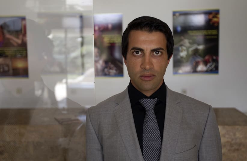  Mosab Hassan Yousef poses for a photo before a news conference in Jerusalem June 19, 2012 (photo credit: REUTERS/Ronen Zvulun)