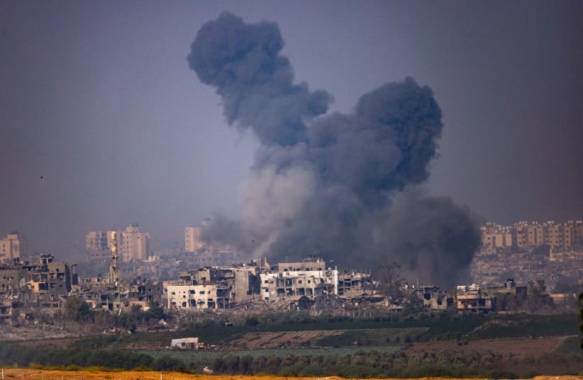  Smoke rises during Israeli airstrikes, in the Gaza Strip, as seen from the Israeli side of the border, on October 28, 2023 (photo credit: YONATAN SINDEL/FLASH90)