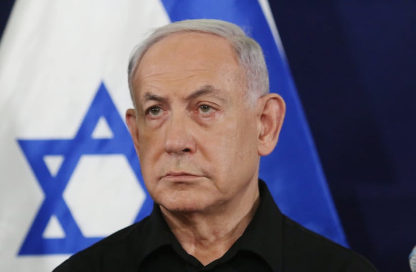  Israeli prime minister Benjamin Netanyahu speaks at a press conference at  the Ministry of Defense, in Tel Aviv. October 28, 2023 (photo credit: Dana Kopel/Pool)