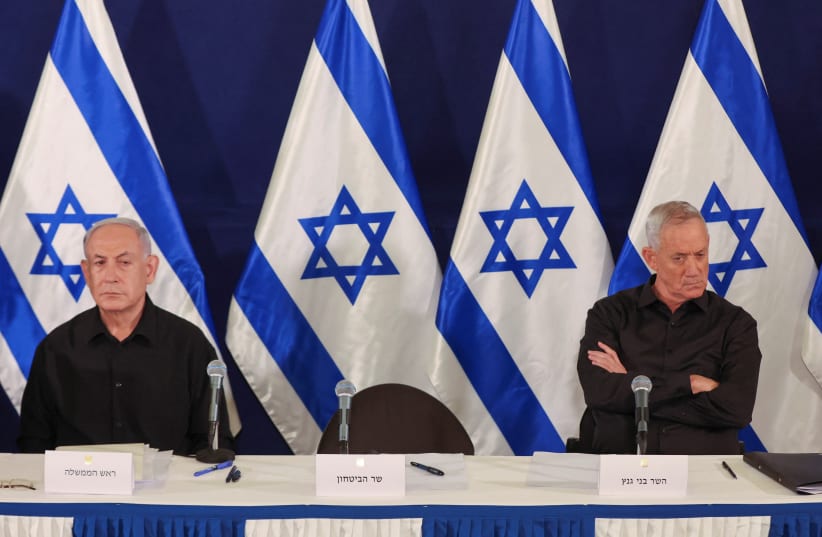  Israeli prime minister Benjamin Netanyahu and Cabinet minister Benny Gantz during a press conference in the Kirya military base in Tel Aviv , Israel , 28 October 2023. (photo credit: BIR SULTAN POOL/Pool via REUTERS)