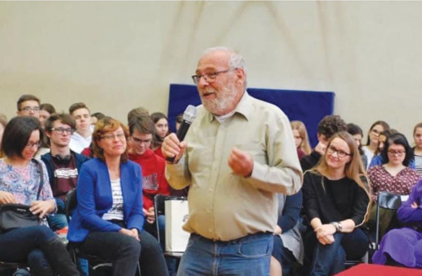  Alex Dancyg lectures a group of educators in Poland. (photo credit: Dancyg family)