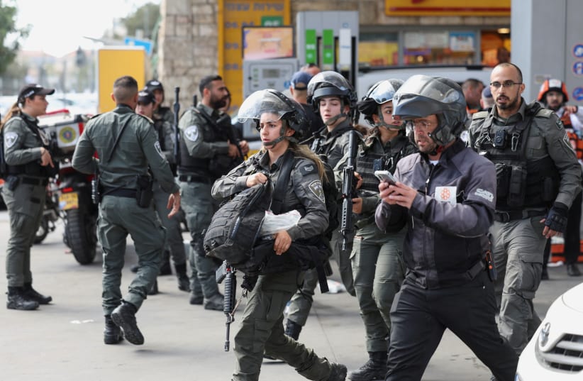 Israeli security personnel secure the scene following an incident in Jerusalem, October 30, 2023 (photo credit: RONEN ZVULUN/REUTERS)
