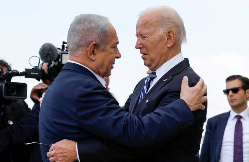  U.S. President Joe Biden is welcomed by Israeli Prime Minster Benjamin Netanyahu, as he visits Israel amid the ongoing conflict between Israel and Hamas, in Tel Aviv, Israel, October 18, 2023. (photo credit: REUTERS/EVELYN HOCKSTEIN)