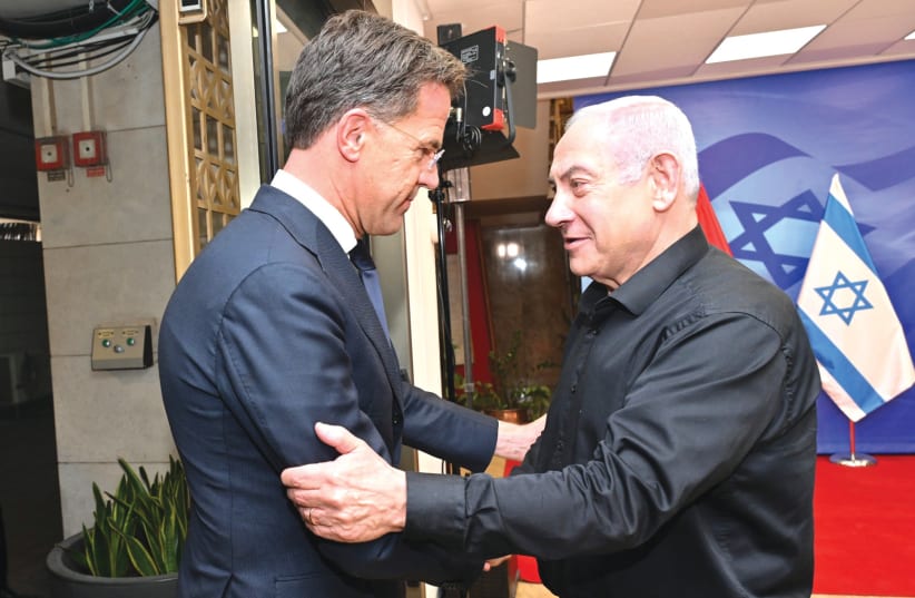  PRIME MINISTER Benjamin Netanyahu in his black attire with Dutch Prime Minister Mark Rutte. (photo credit: KOBI GIDEON/GPO)